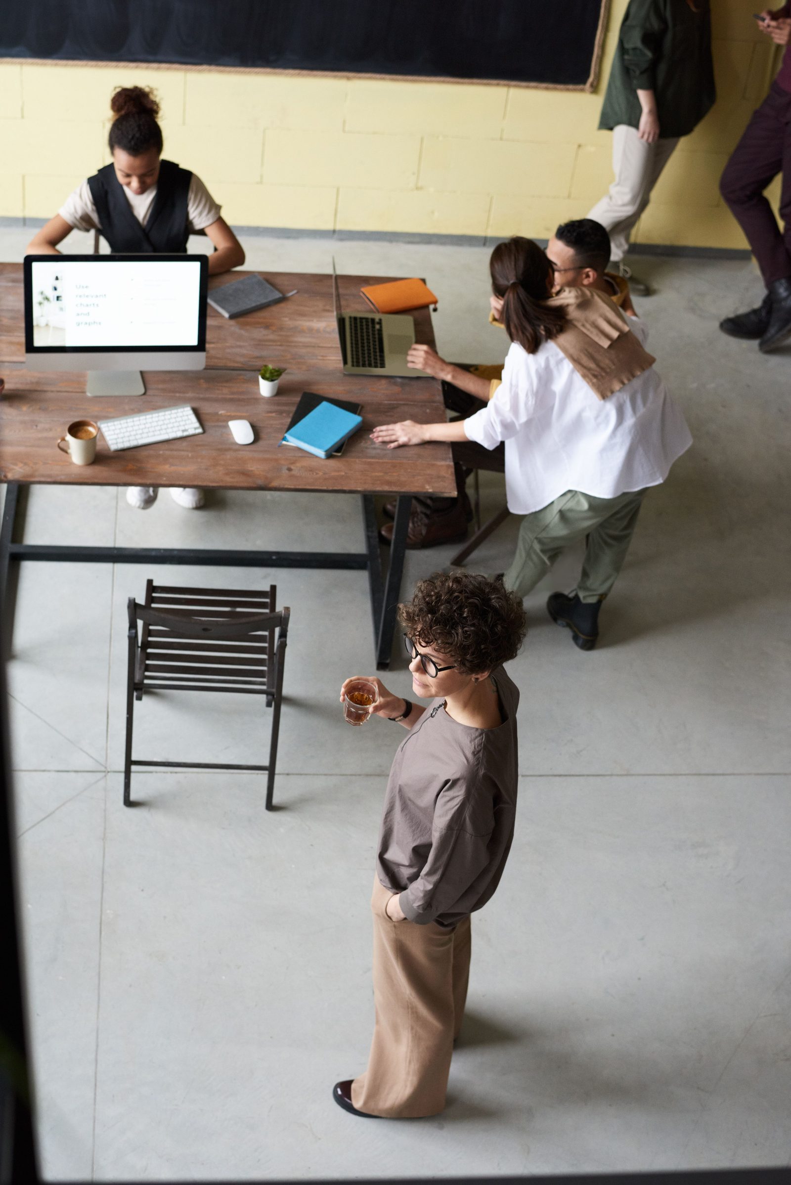 A team working together, seen from above a studio table.